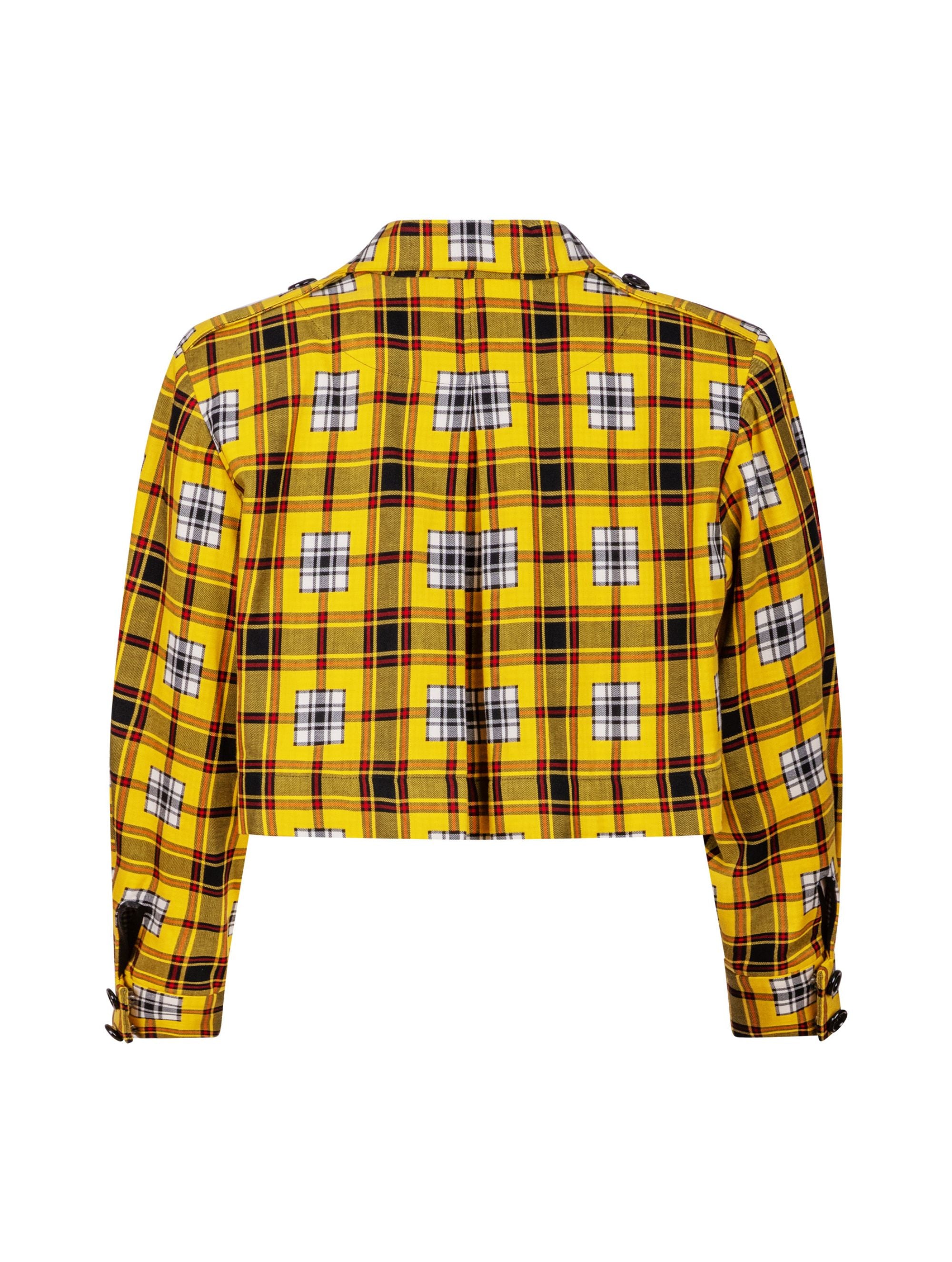 Doppelseitige Karo-Kurzjacke mit abnehmbaren Schulterpolstern, eingesetzten Ärmeln mit Ärmelgürteln und Schulterklappen sowie vorderen Halbpasse. Die Jacke kann von beiden Seiten getragen werden. Hergestellt aus Naturfasern.