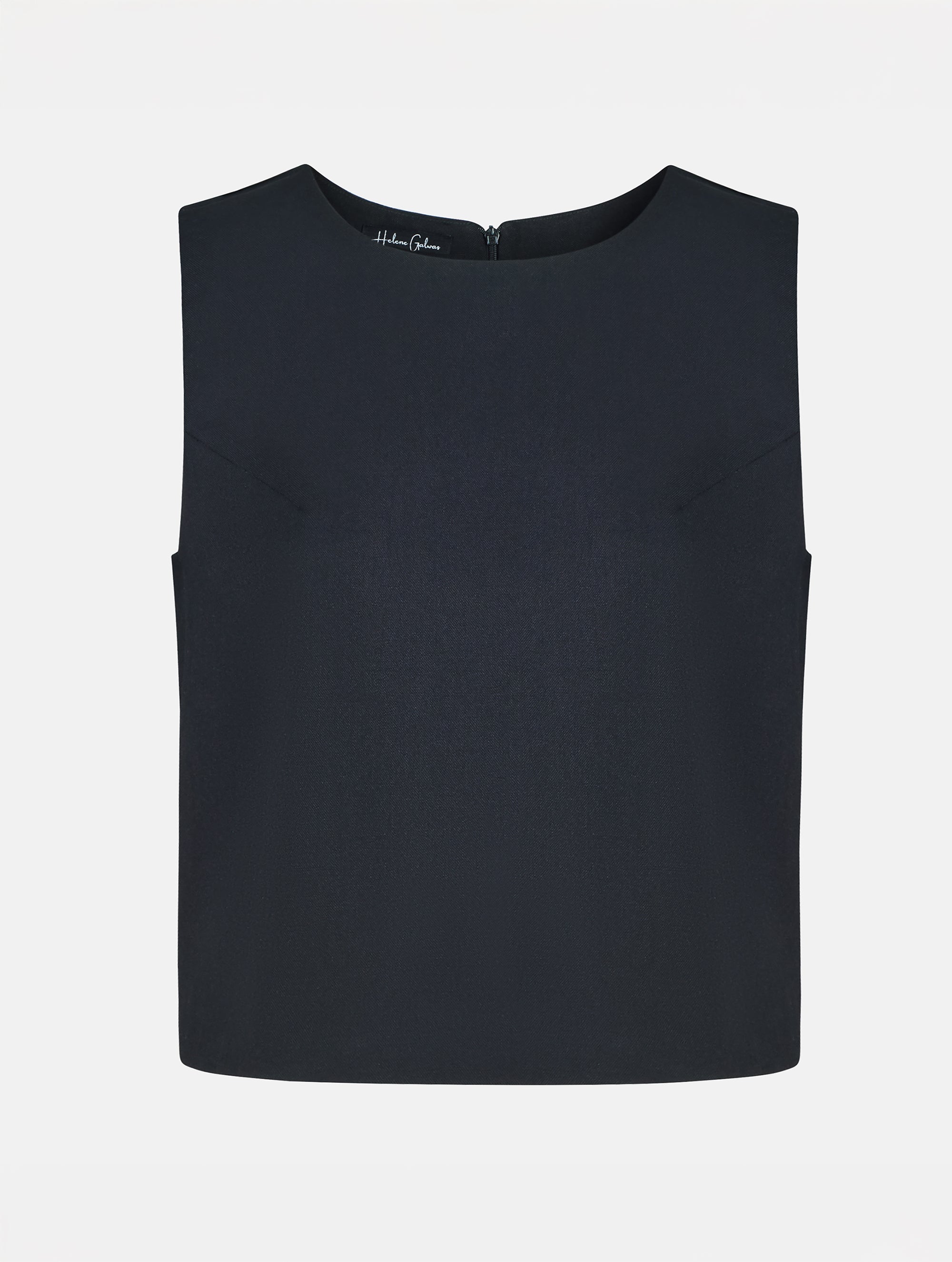 Grade geschnittenes kurzes Top aus Woll-Mix mit abnehmbaren langen Fransen aus Viskose. Dieses Modell ist Teil unserer Reborn Linie, da aus dem ehemaligen Top Alissa hergestellt worden ist.