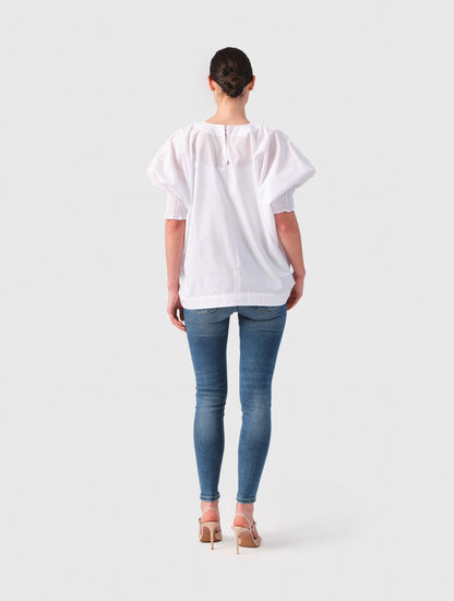 Locker sitzende Bluse mit elastischen Bündchen an den Ärmelenden. 