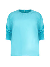 Locker sitzende Bluse mit elastischen Bündchen an den Ärmelenden. 