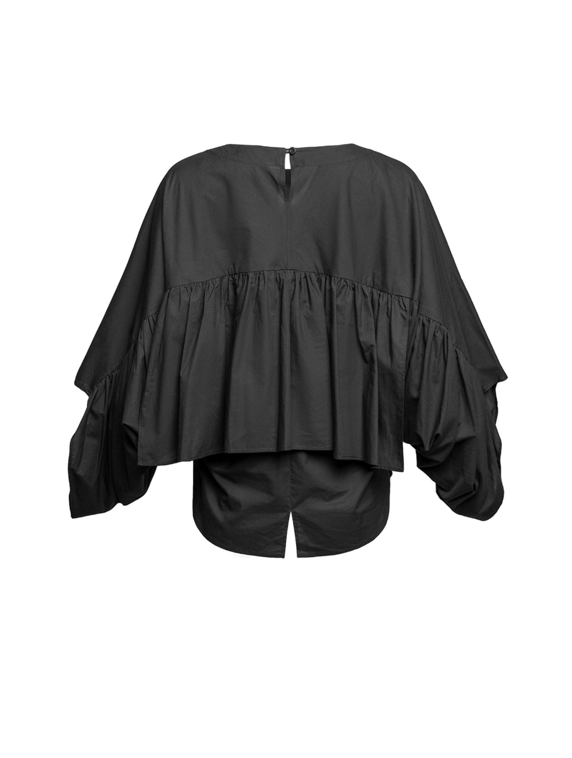 Bluse aus 100% feiner Baumwolle, Rundhalsausschnitt und breiten horizontal verlaufenden Volants im Vorder- und Rückteil sowie an den Ärmeln ausgestattet