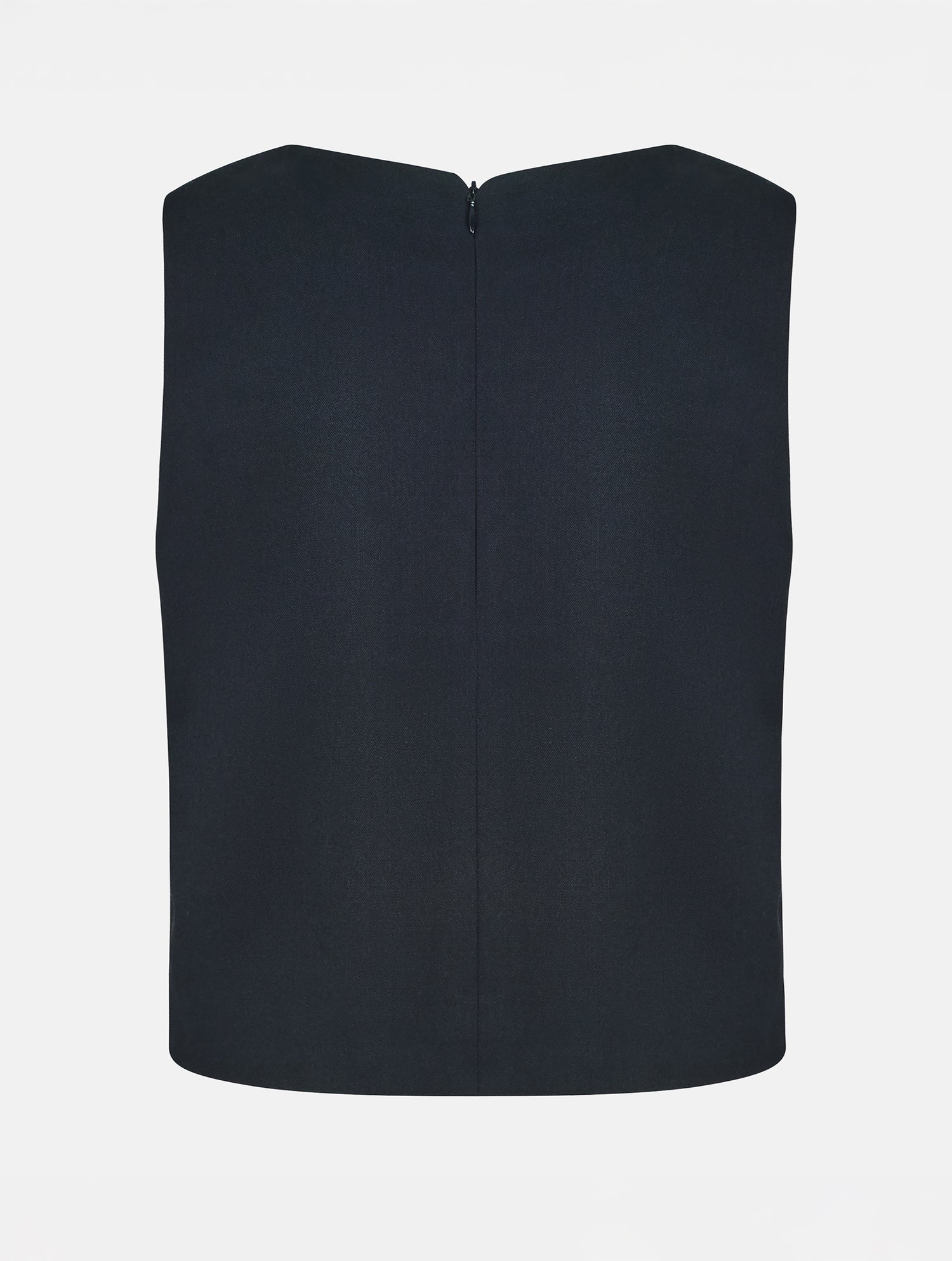 Grade geschnittenes kurzes Top aus Woll-Mix mit abnehmbaren langen Fransen aus Viskose. Dieses Modell ist Teil unserer Reborn Linie, da aus dem ehemaligen Top Alissa hergestellt worden ist.