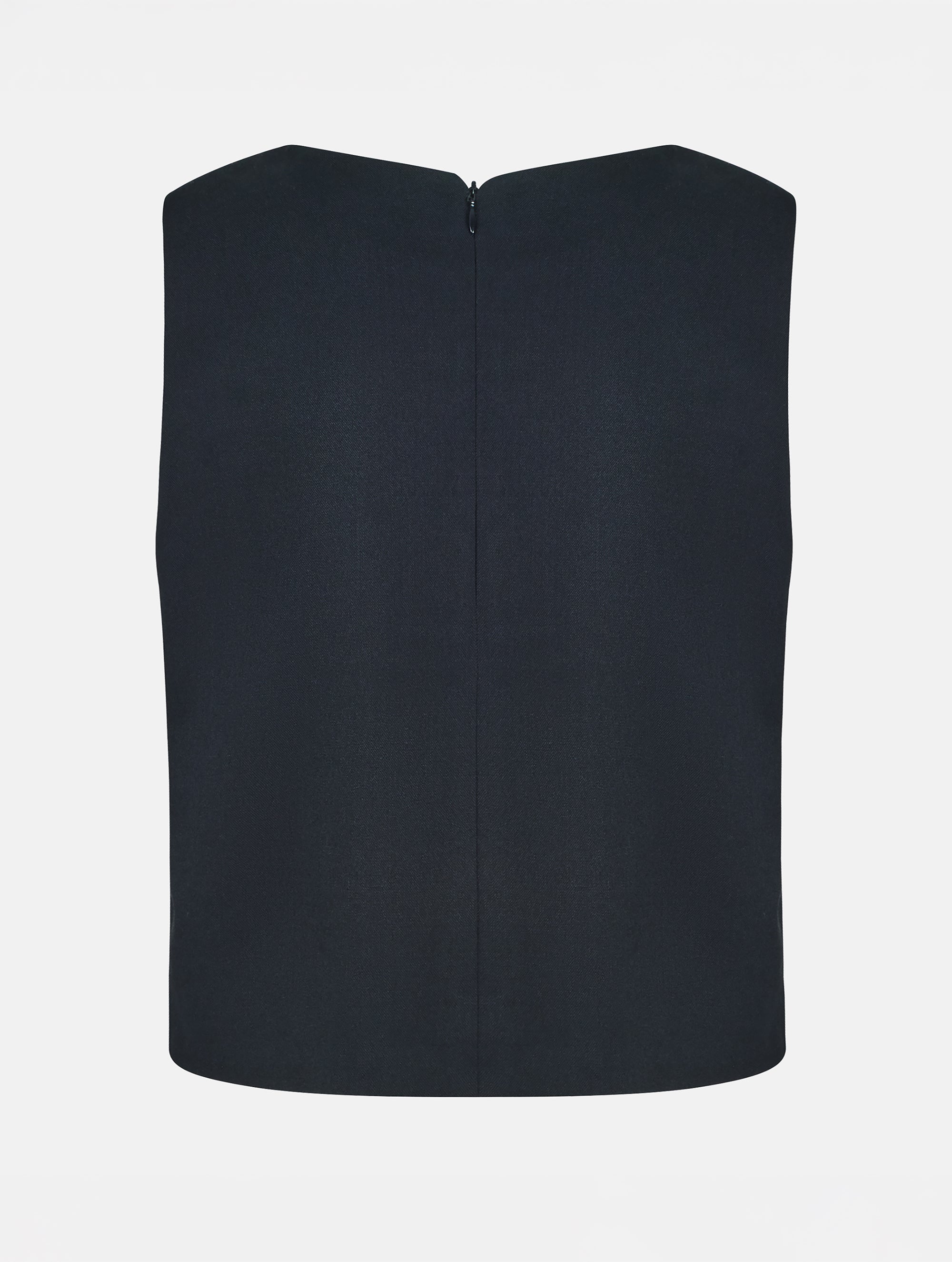 Grade geschnittenes kurzes Top aus Woll-Mix mit abnehmbaren langen Fransen aus Viskose. Dieses Modell ist Teil unserer Reborn Linie, da aus dem ehemaligen Top Alissa hergestellt worden ist.