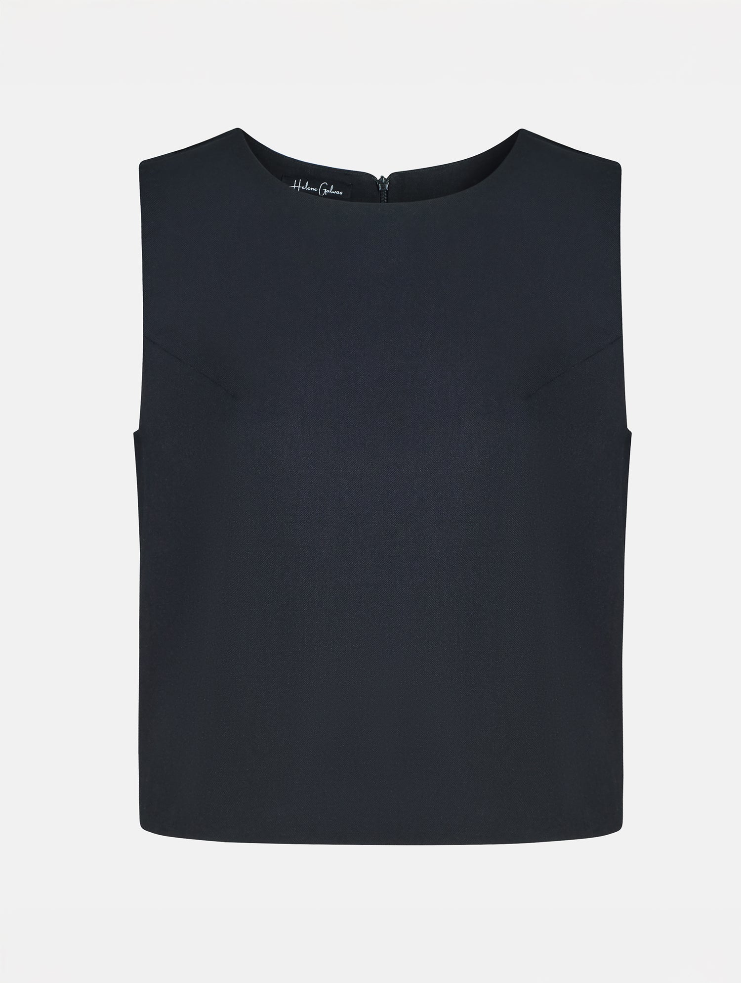 Grade geschnittenes kurzes Top aus Woll-Mix mit abnehmbaren langen Fransen aus Viskose. Dieses Modell ist Teil unserer Reborn Linie, da aus dem ehemaligen Top Alissa hergestellt worden ist.