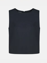 Grade geschnittenes kurzes Top aus Woll-Mix mit abnehmbaren langen Fransen aus Viskose. Dieses Modell ist Teil unserer Reborn Linie, da aus dem ehemaligen Top Alissa hergestellt worden ist.