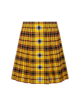 Doppelseitig karierter Faltenminirock mit elastischem Bund und Knopfleiste auf der Vorderseite. Der Rock kann von beiden Seiten getragen werden. Hergestellt aus Naturfasern.